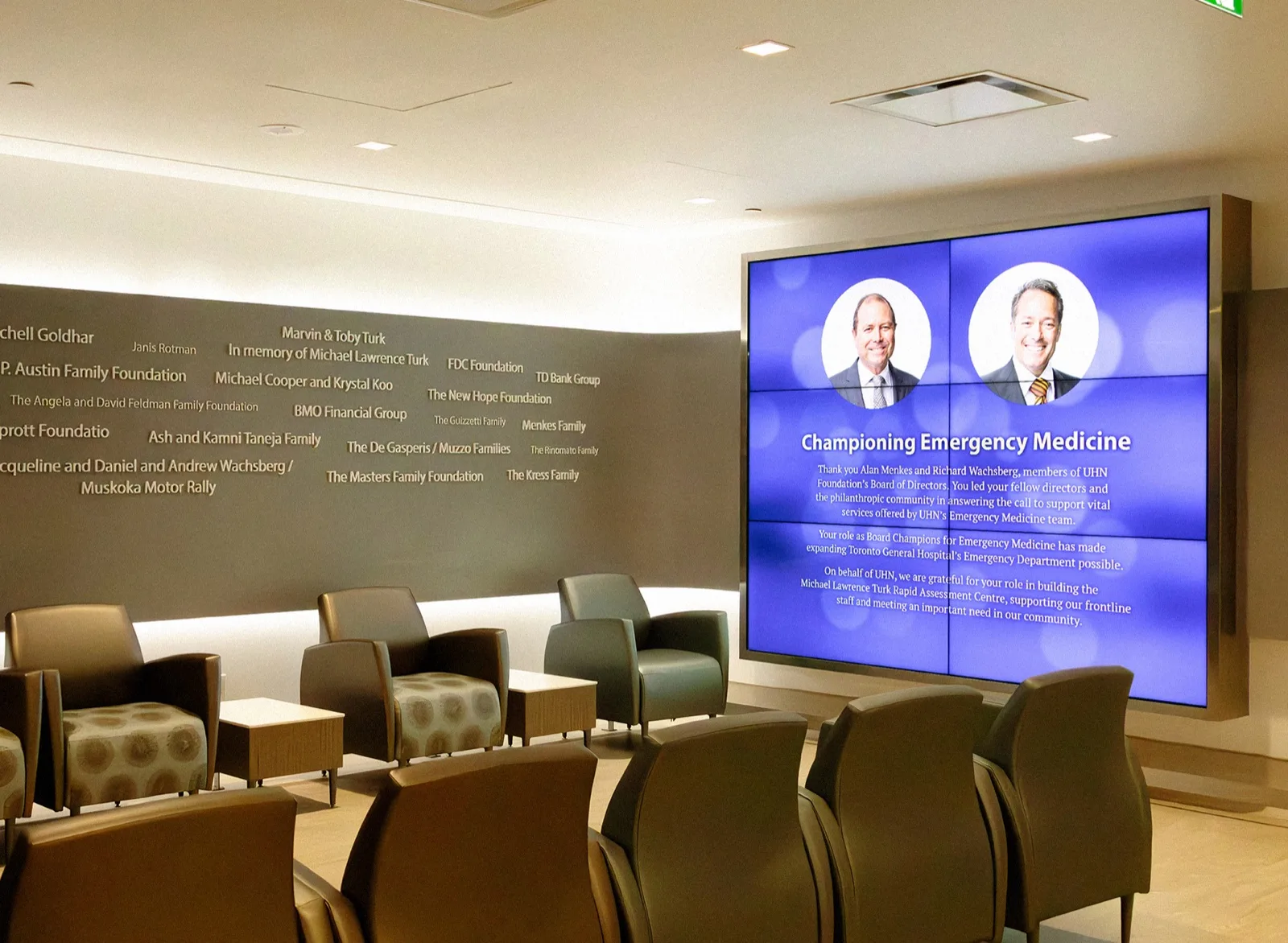 The completed recognition wall installed and running in the finished space