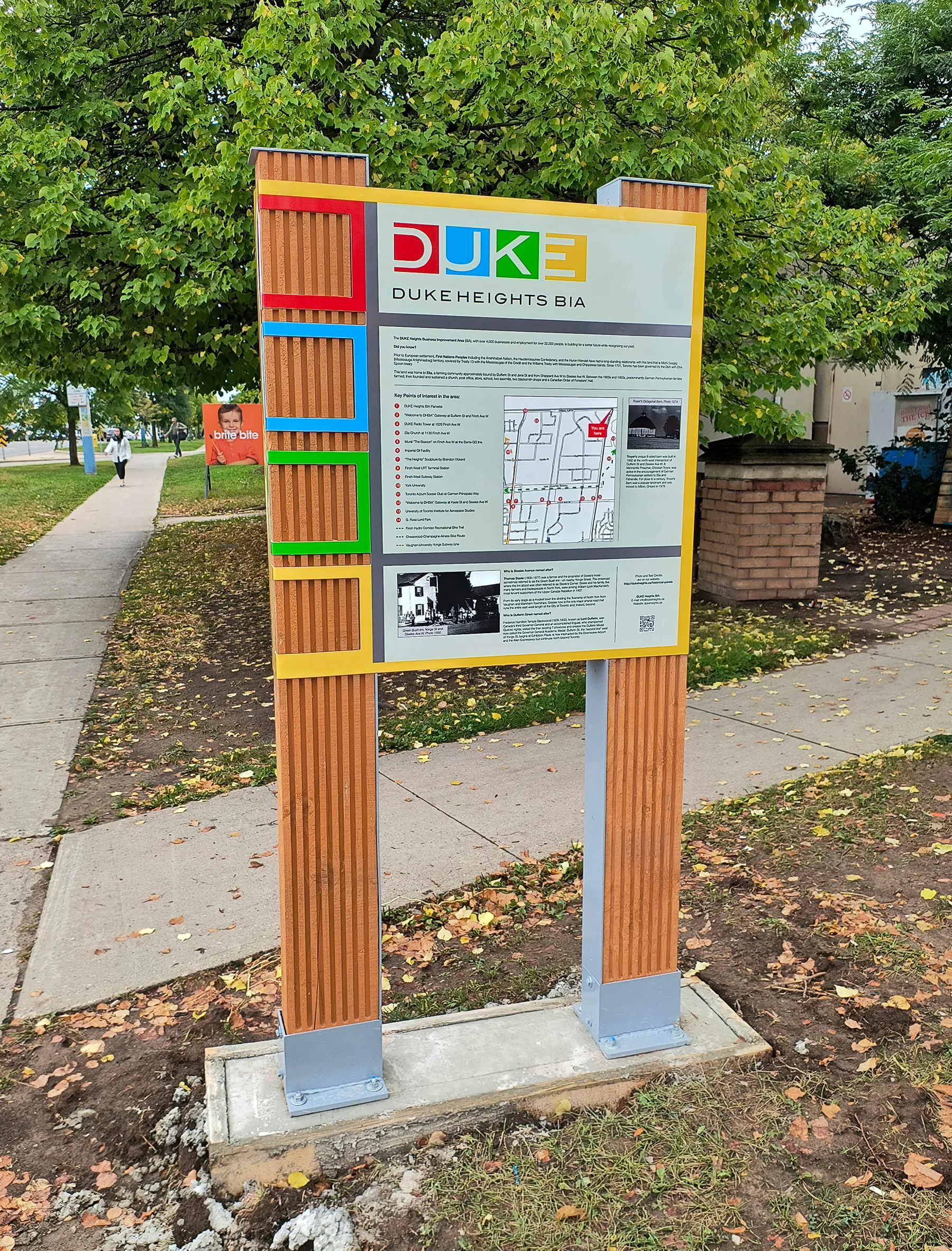 Duke Heights BIA historical marker panel with district map and wayfinding
