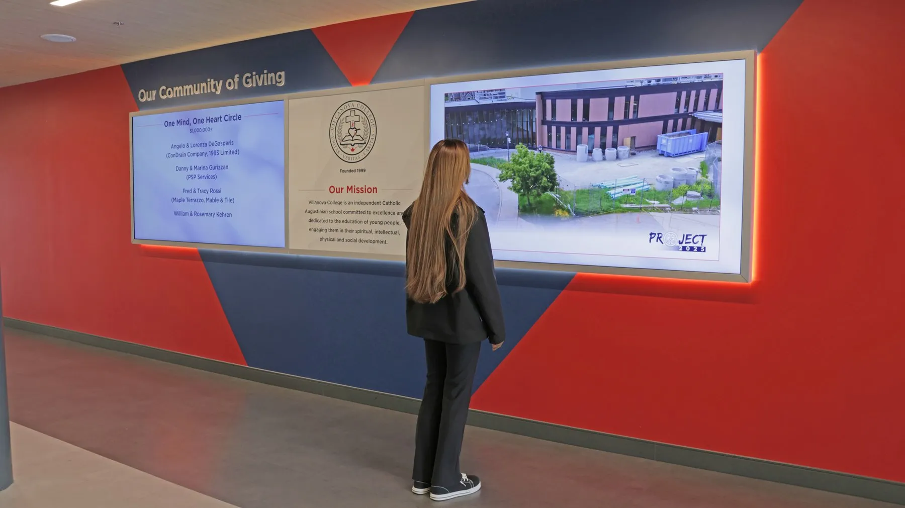 A visitor viewing the Project 2025 screen showing the completed expansion